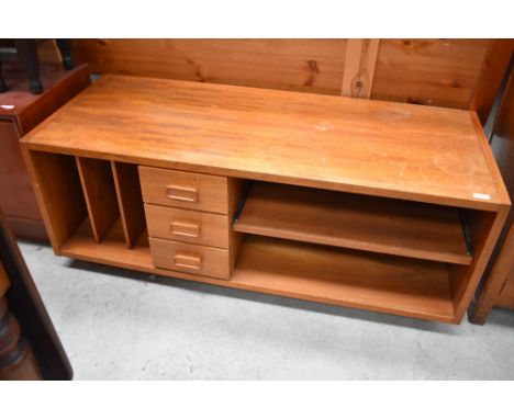 A vintage teak effect entertainment stand, width approx. 122cm
