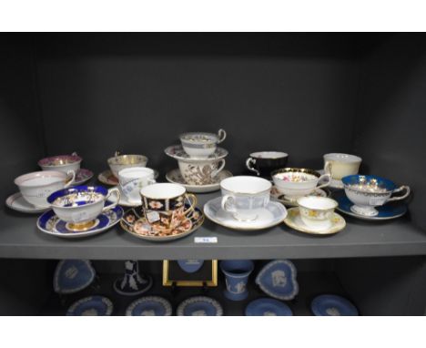 A mixed lot of antique and vintage cups and saucers, including Royal Crown Derby in Imari colour way, Paragon and Aynsley.