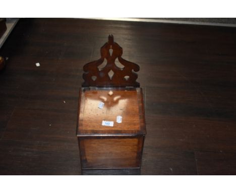 A late 19th century mahogany candle box, having carved back and inlaid detailing to lid and front.
19.5cm deep, 44cm to top o