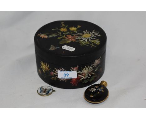 An antique lacquered box of circular form having floral painted decoration, two gold tone stick pins, a string of 1950s beads
