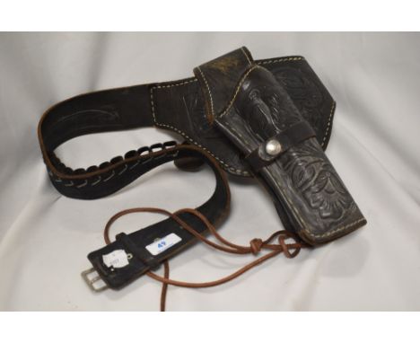 A vintage embossed Mexican style leather holster.