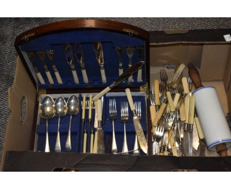 An early 20th century mahogany canteen containing plated knives and forks with bone handles and stainless steel forks and spo