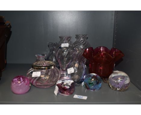A small collection of Caithness and similar paperweights and vases, and a Victorian ruby glass vase