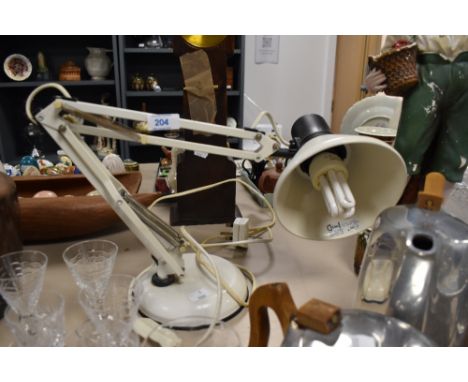 A vintage white Anglepoise desk lamp.