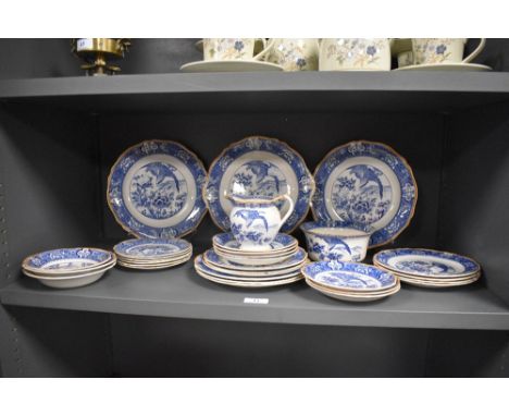 A selection of early 20th century blue and white table ware, to include, graduated plates, sugar basin and jug, marked to rev