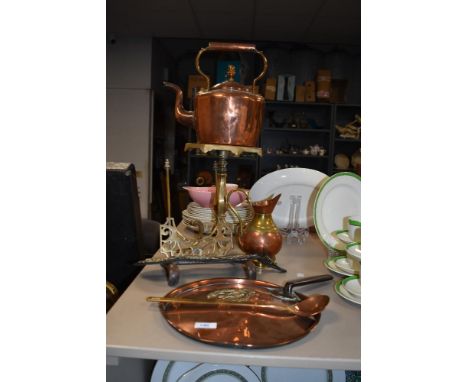 A vintage copper kettle, a copper griddle, a brass trivet on stand and more.