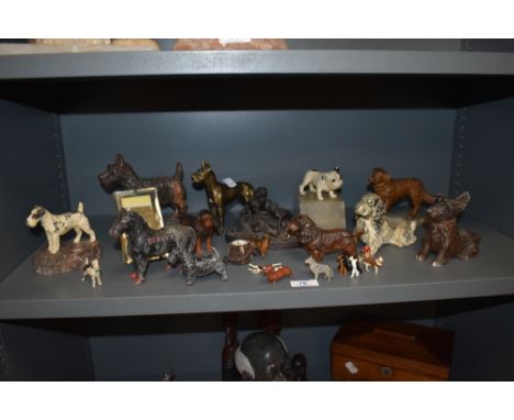 A mixed lot of vintage and antique items of dog related interest, including terrier and spaniel cast metal desk top lighters,