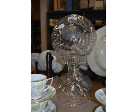 A crystal table lamp, having spherical shade with etched floral decoration, in the manner of Waterford.