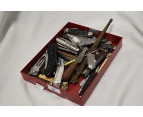 A collection of vintage pen knives and multi tools, etc.