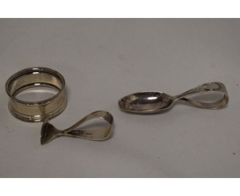 A silver babies feeding spoon and sugar push, together with a silver napkin ring