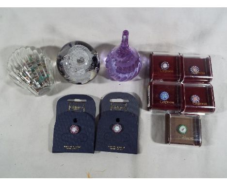 Three glass paperweights to include Caithness ring stand, a handmade Tweedsmuir glass dome paperweight, a paperweight in the 