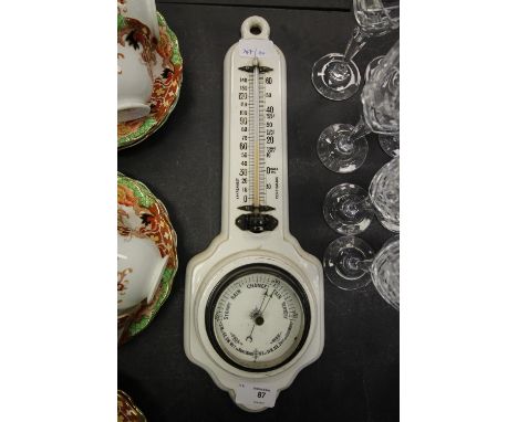 White glazed ceramic barometer with a Registration number