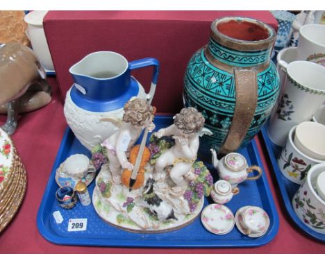 A Middle Eastern Pottery Vase, with brass mounts, No. 224 pottery hunting jug, Meissen style musical cherubs figure group, mi