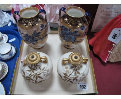 A Pair of Royal Doulton Twin Handled Vases, of flattened ovoid form, decorated with blue flowers on a dusty gilt ground, with