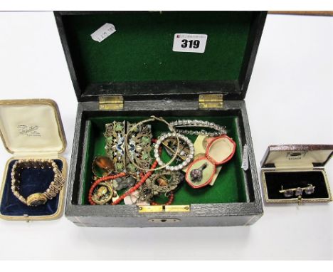 Enamel Brooch, colourless paste buckle, ring, brooches, expanding bracelet, bangle, buttons etc, contained in an old jeweller