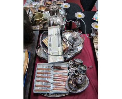 An Electroplated Three Branch Candelabra, pair of reeded candlesticks, cased tea knives and carving set, two shaped oval gall