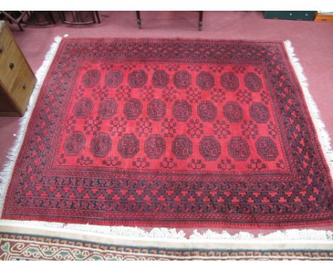 Persian Wool Tasseled Carpet, circa mid XX Century featuring three bands of eight octagonal gulls to centre and floral and pa