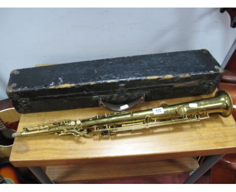 A XX Century Brass Clarinet, markers marks rubbed, stamped 238177, in hard fitted case. 