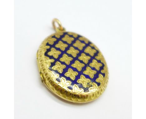 A yellow metal locket, enamel a/f, 6.6g, 24mm x 29mm 