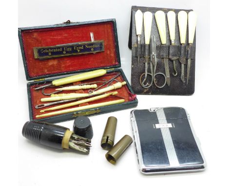 Two sewing kits, a manicure set, a Ronson lighter, a cigarette case combination and a corkscrew handle 
