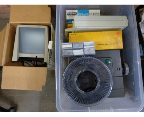 An Agfa slide projector with approximately 160 35mm slides, a Kodak Carousel magazine and lens, a 35mm slide viewer and vario