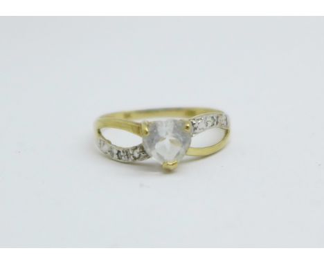 A 9ct gold heart shaped ring with a small diamond set on each shoulder, 1.1g, O 