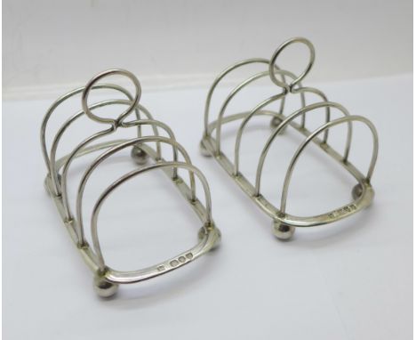 A pair of Victorian silver toast racks, Henry Wilkinson &amp; Co., London 1894, 130g 