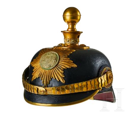 A helmet for Field Artillery 24, Battalion III Mecklenburg-Strelitz Officers Black lacquered leather body; front visor with d