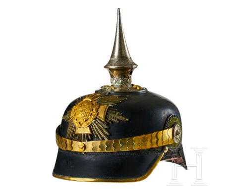 A helmet for Saxon Pioneer Reserve Officers Black lacquered leather body; front visor with green underlay, rear visor with re