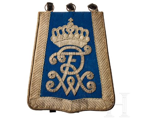 A German Hussar sabretache  Blue cloth U-shaped base, embroidered silver lace trim around three sides, at centre a lace embro