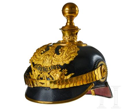 A helmet for Prussian Field Artillery Regt. 2 Officers Black lacquered leather body; front visor with green underlay and rear