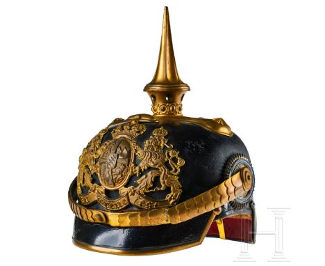 A helmet for Bavarian Chevauleger Officers Black lacquered leather body; front visor with green underlay, rear visor with red