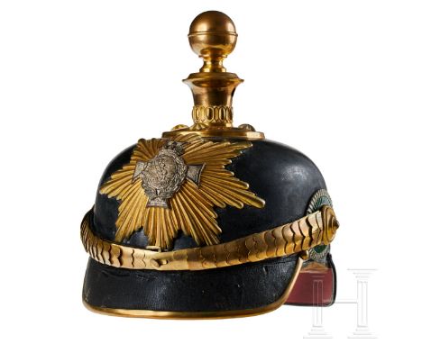 A helmet for Saxon Field Artillery Reserve Officers Black lacquered leather body; front visor with green underlay, rear visor