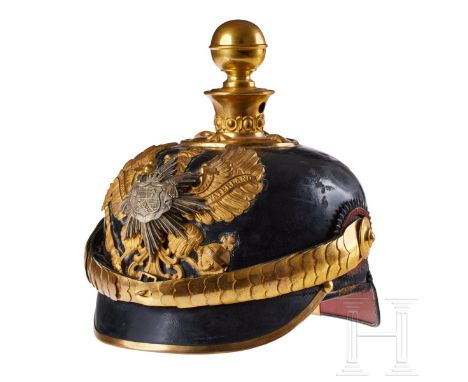 A helmet for Oldenburg Field Artillery Regt. 62 Officers Black lacquered leather body; front visor with green underlay, rear 