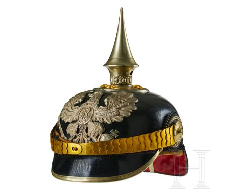 A helmet for Prussian Pioneer Battalion 1 Officers Black lacquered leather body; front visor with green underlay, rear visor 