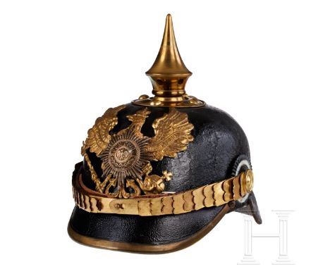 A helmet for Enlisted Men at Prussian NCO Schools Black lacquered leather body, front and rear visor; gilt: round spike base,