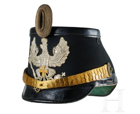 A shako for Prussian Telegraph Reserve Officers Black felt covered body with black leather front and rear visors; silver fron