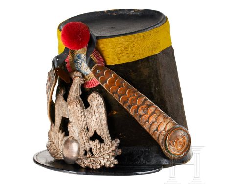 A French voltigeur shako  Cap body in brown horsehair, black fibreboard top trimmed in yellow fabric band. Red, white and blu