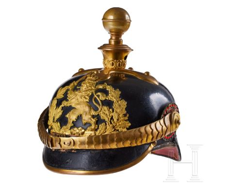 A helmet for Hessian Field Artillery 61 Officers Black lacquered leather body; front visor with green underlay, back visor wi