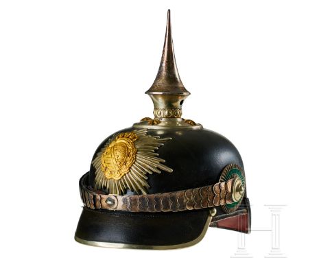 A helmet for Saxon Grenadier Regt. 100 Officers Black lacquered leather body; front visor with green underlay, rear visor wit