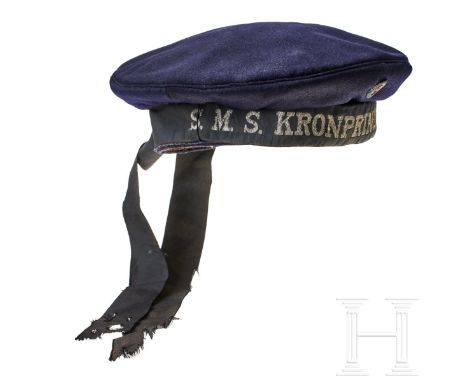 A German navy cap for enlisted personnel  Cap body of dark-blue wool, black cap tally ribbon, "S.M.S. KRONPRINZ WILHELM" mach