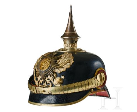A helmet for Lippe Gendarmerie Officers Black lacquered leather body; front visor with green underlay, rear visor with red un