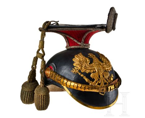 A Prussian 2nd Uhlan Officers czapka Black lacquered leather body, gilt rounded front visor trim; gilt officer front plate of