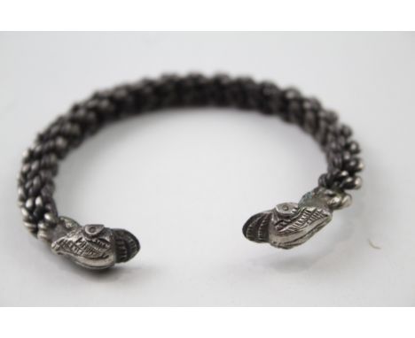 Silver vintage bangle with stylised dolphin torque ends (49g)