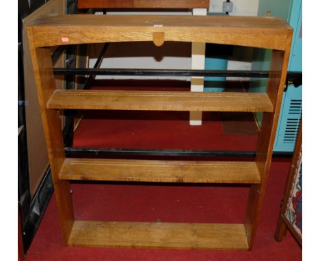 An early 20th century oak three tier open hanging wall shelf