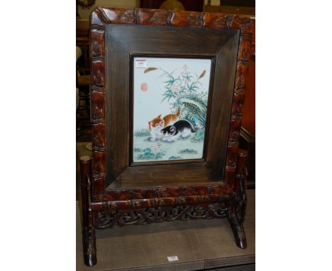 A contemporary Chinese stained wood and enamel porcelain inset fire screen Condition Report / Extra Information Porcelain ins