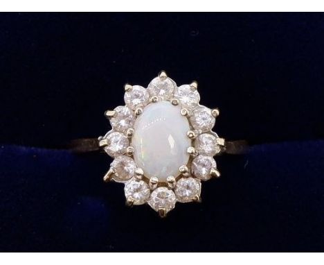 A 9 carat gold opal and white stone ring, size I, 1.8g 