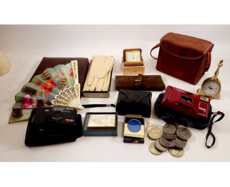 A box of collectables including cameras, Swan musical compact, leather gloves, travel clock etc