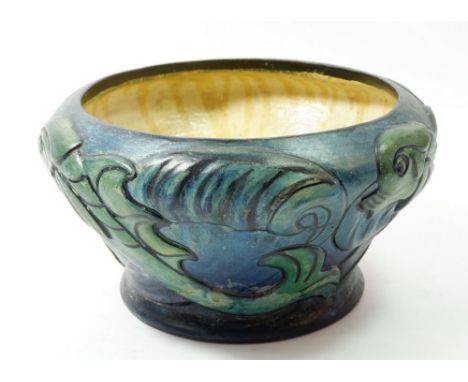 A Compton Pottery dolphin bowl, 25cm diameter 