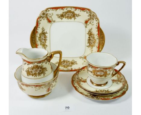 A Meito porcelain tea service comprising: eight cups and saucers, eight tea plates, milk, sugar and two cake plates 